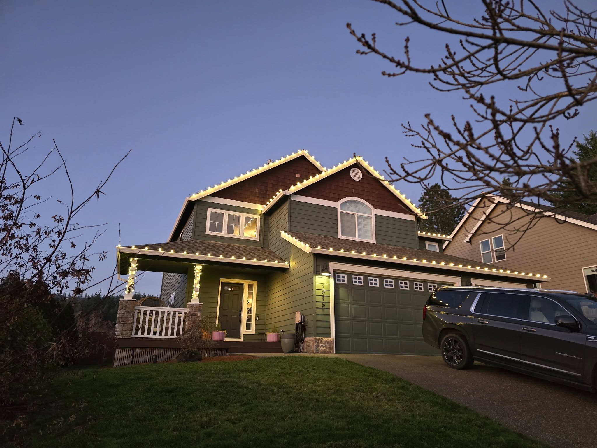 Professional Christmas lights installation displaying warm white lights on Salem Oregon home exterior