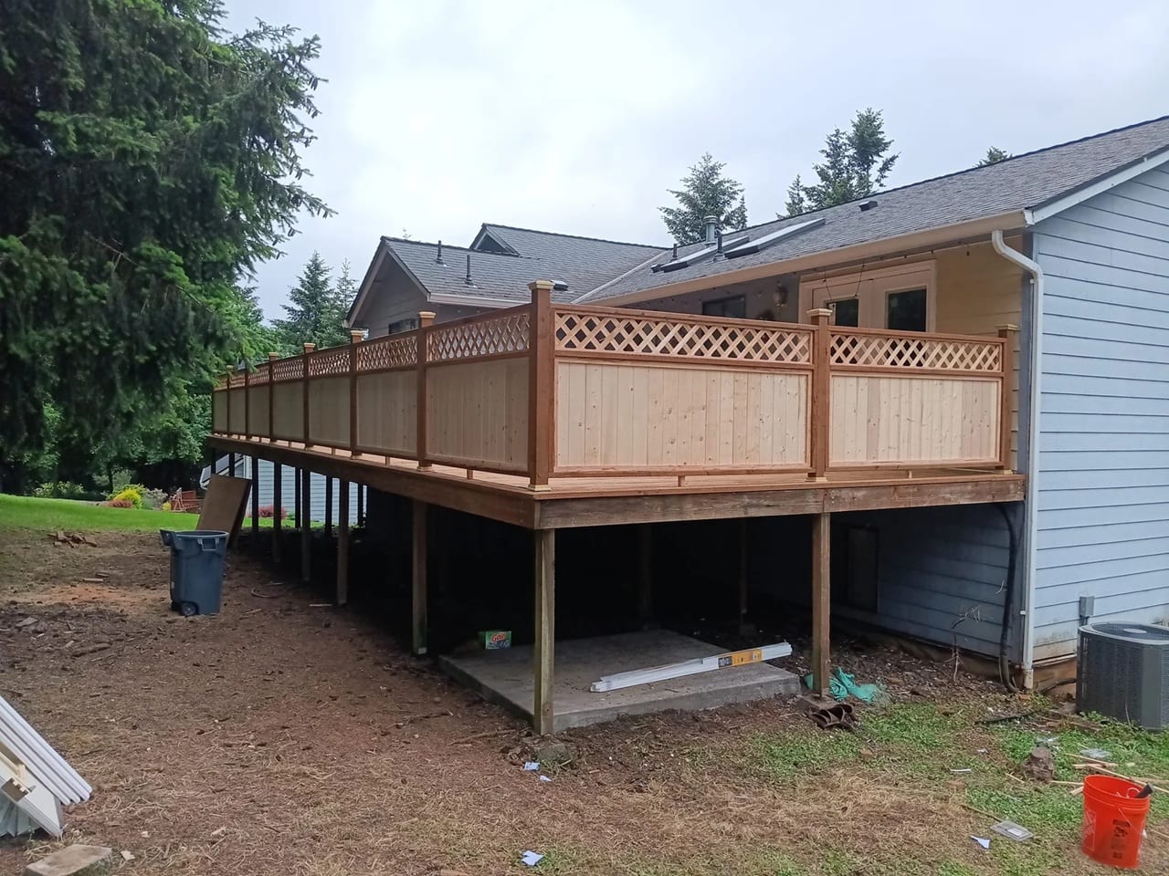 Elevated cedar deck with a lattice privacy rail, built by On Top Home Services and affiliates