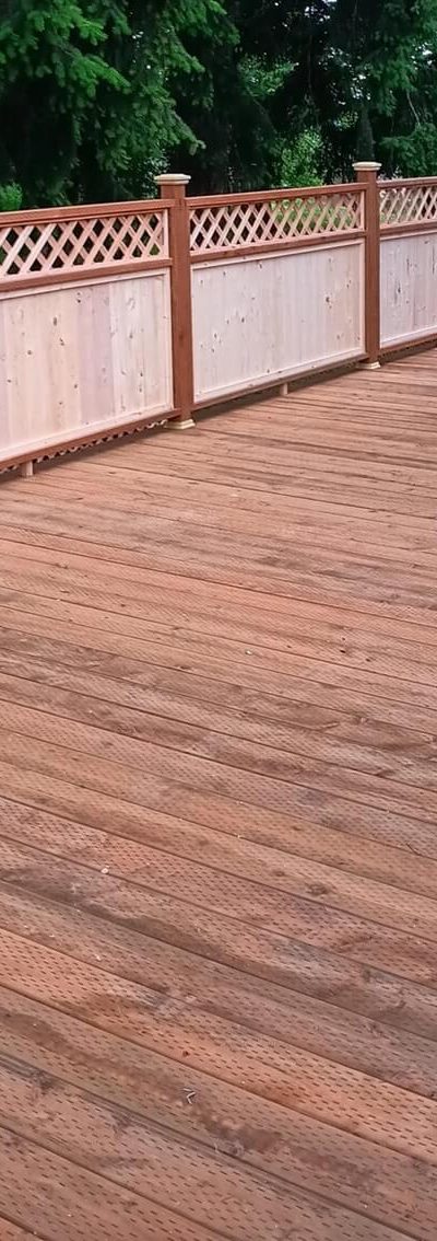 Cedar deck boards and a lattice privacy rail, built by On Top Home Services and affiliates