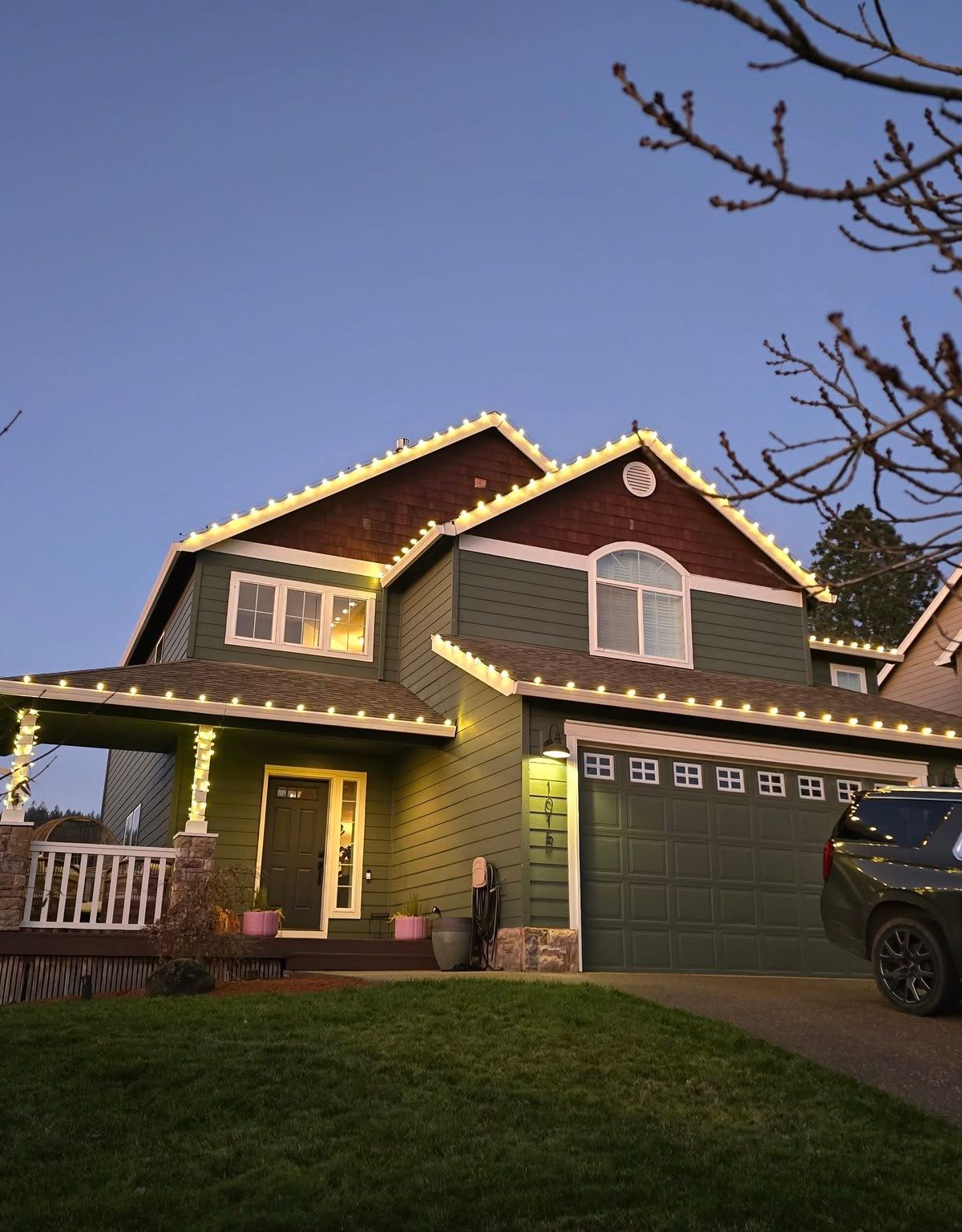 Professional Christmas lights installation displaying warm white lights on Salem Oregon home exterior